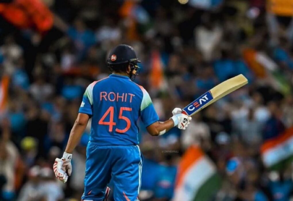 Rohit Sharma celebrates after scoring a century for India during an ODI match.