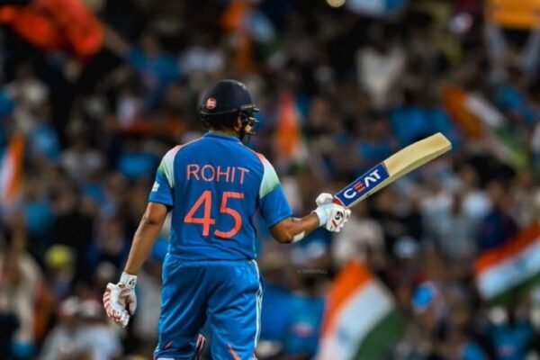 Rohit Sharma celebrates after scoring a century for India during an ODI match.